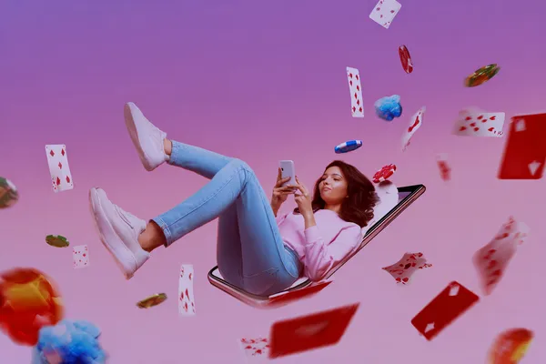 A young woman relaxing with her phone while dynamic casino elements float around her, illustrating the smooth mobile experience offered by the 786BETT app.