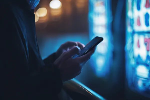 A glamorous woman holding casino chips in a neon-lit environment, representing the premium online casino atmosphere of 786BETT.