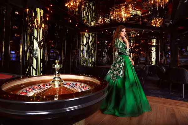A professional dealer in a tuxedo greeting players at the roulette table, symbolizing the authentic live casino feel at 786BETT.